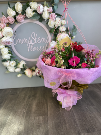 Stunning Mix - Beautiful mix of rich reds and cerise pink flowers  and lovely Foliage finished in a luxury Gift Wrap. Stunning Mix - Beautiful mix of rich reds and cerise pink flowers  and lovely Foliage finished in a luxury Gift Wrap.