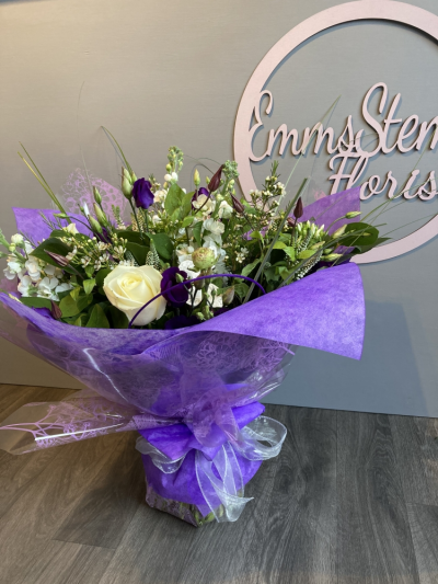 Sweetness - A beautiful Bouquet full of Purple and White Flowers with foliage and finished in a stunning gift wrap in water. Sweetness - A beautiful Bouquet full of Purple and White Flowers with foliage and finished in a stunning gift wrap in water.