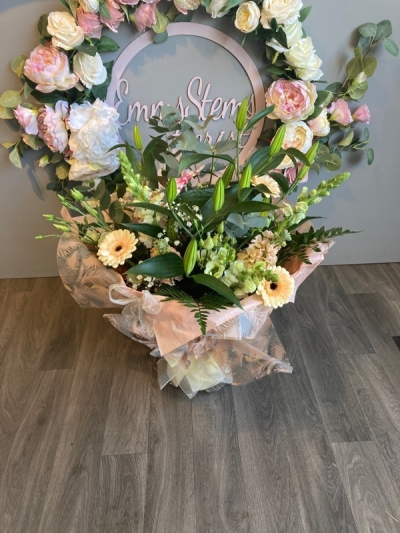 Peaches and Cream - Seasonal Flowers in shades of soft peach and cream arranged as a beautiful aqua packed bouquet. Peaches and Cream - Seasonal Flowers in shades of soft peach and cream arranged as a beautiful aqua packed bouquet.