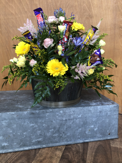 Two of the Best Things - This lovely arrangement is arranged in a basket (colour may vary), with seasonal flowers and has Chocolate Bars added in ! Win Win Two of the Best Things - This lovely arrangement is arranged in a basket (colour may vary), with seasonal flowers and has Chocolate Bars added in ! Win Win
