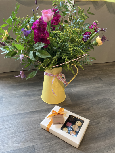 Jug Gift & Chocolates - A lovely scented hand tied bouquet presented in a yellow jug and also includes a box of luxury chocolates. Jug Gift & Chocolates - A lovely scented hand tied bouquet presented in a yellow jug and also includes a box of luxury chocolates.