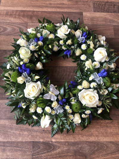 Blue and Cream Wreath - Wreath textured Tribute made in Blue and Cream Flowers. Sizes start from 12",14" & 16" Blue and Cream Wreath - Wreath textured Tribute made in Blue and Cream Flowers. Sizes start from 12",14" & 16"