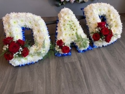 Red and Blue DAD Letters - DAD Letters, with a Blue Ribbon edge, White base flowers and beautiful Red Roses in sprays on each letters. Red and Blue DAD Letters - DAD Letters, with a Blue Ribbon edge, White base flowers and beautiful Red Roses in sprays on each letters.