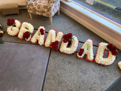 Red Grandad Tribute - Grandad Tribute. With Red Ribbon Edge, White Based Flowers and Red Rose letter sprays Red Grandad Tribute - Grandad Tribute. With Red Ribbon Edge, White Based Flowers and Red Rose letter sprays