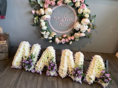 NANA - NANA, based in white flowers with a Lilac ribbon & flower sprays NANA - NANA, based in white flowers with a Lilac ribbon & flower sprays