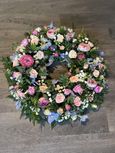 Wreath - Wreath with seasonal flowers in pink, white and blue.
Standard- 12"
Medium - 14"
Large- 16"
Extra Large- 18" Wreath - Wreath with seasonal flowers in pink, white and blue.
Standard- 12"
Medium - 14"
Large- 16"
Extra Large- 18"
