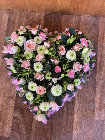 Heart - Heart with pale pink & white flowers with a pink ribbon edge.
Standard- 12"
Medium-15"
Large-18" Heart - Heart with pale pink & white flowers with a pink ribbon edge.
Standard- 12"
Medium-15"
Large-18"