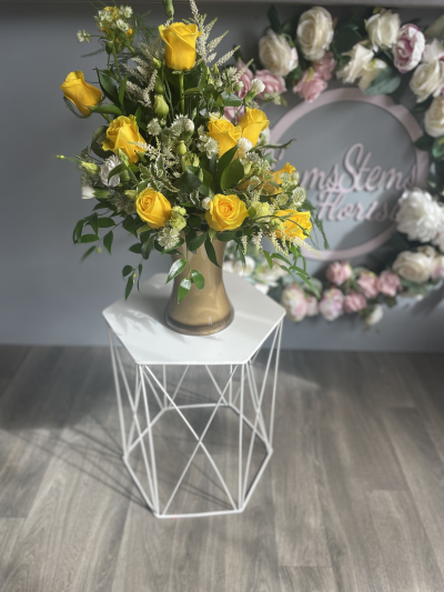 Golden Celebration - Beautiful Yellow Roses arranged in a lovely Gold Vase. Golden Celebration - Beautiful Yellow Roses arranged in a lovely Gold Vase.