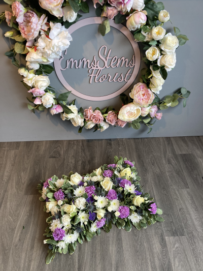 Open Based Pillow in Lilac & White - A soft and serene tribute with lilac carnations, white roses, and gentle greenery, offering comfort and grace during a difficult time. Open Based Pillow in Lilac & White - A soft and serene tribute with lilac carnations, white roses, and gentle greenery, offering comfort and grace during a difficult time.